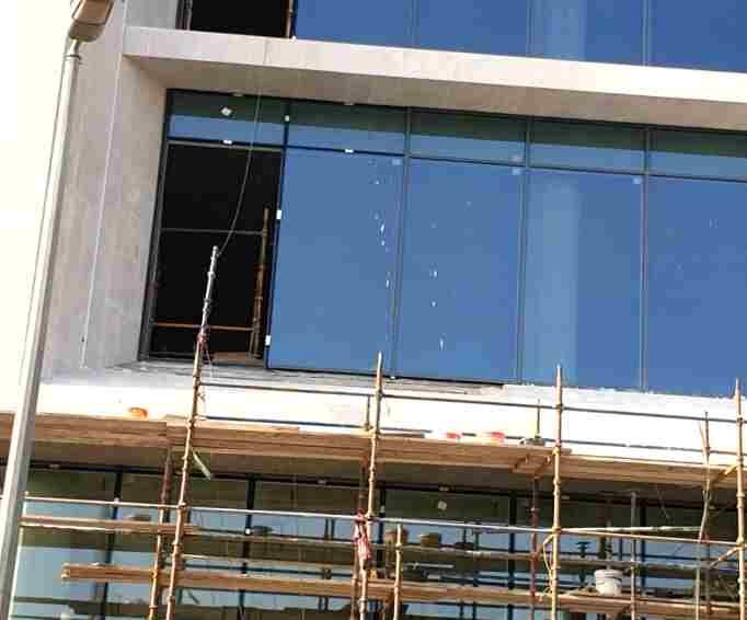 Curtain-wall glazing installed off external scaffold.