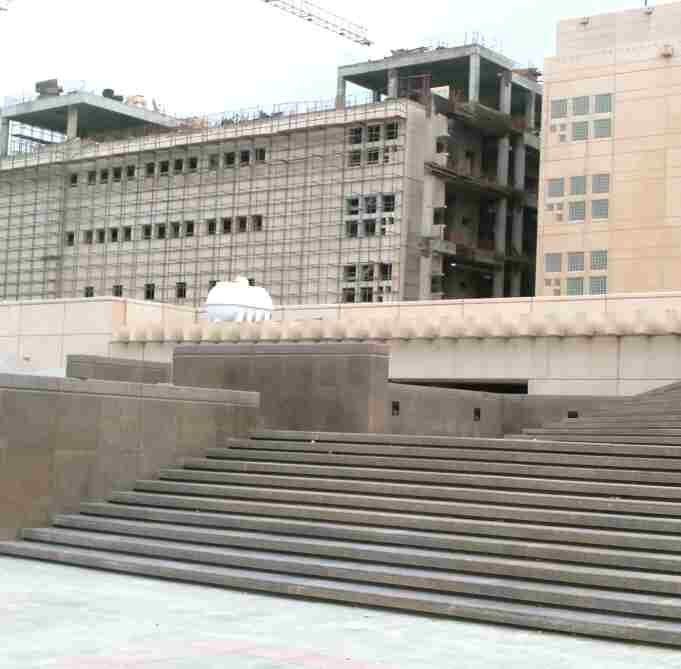 Terraced plaza steps and hardscape to a public frontage.